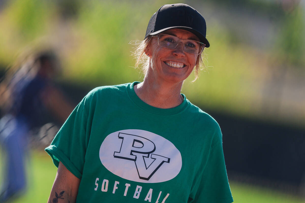 Palo Verde softball head coach Kelly Glass smiles at one of her players during a high school Cl ...