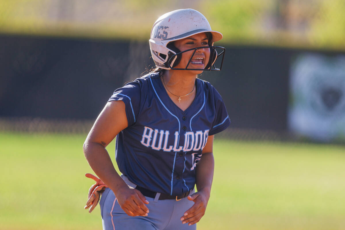 Centennial’s Amanda Campos-Colon yells to a teammate during a high school Class 5A Softb ...