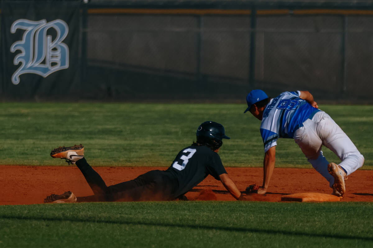 Basic second baseman Tate Southisene (8) puts out Faith Lutheran’s Eli Leone (3) after h ...