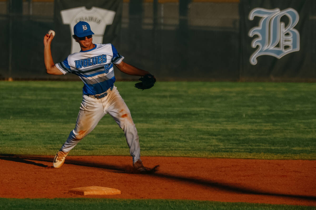 Basic’s Tate Southisene (8) winds up to toss to first during the NIAA 5A Southern Region ...