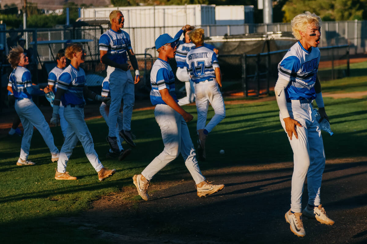 Basic’s baseball team leaps out of the dugout and onto the field to celebrate teammate T ...