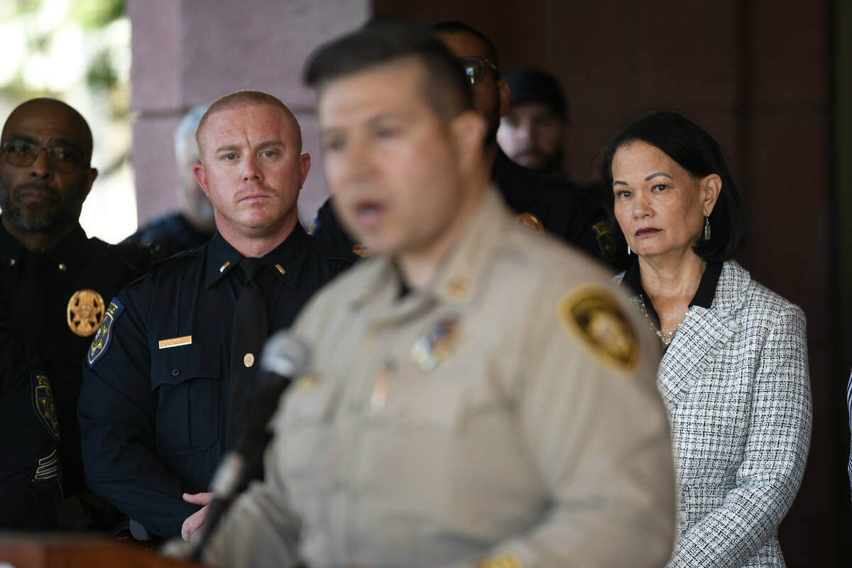 Clark County School District Superintendent Jhone Ebert, right, listens as Metropolitan Police ...