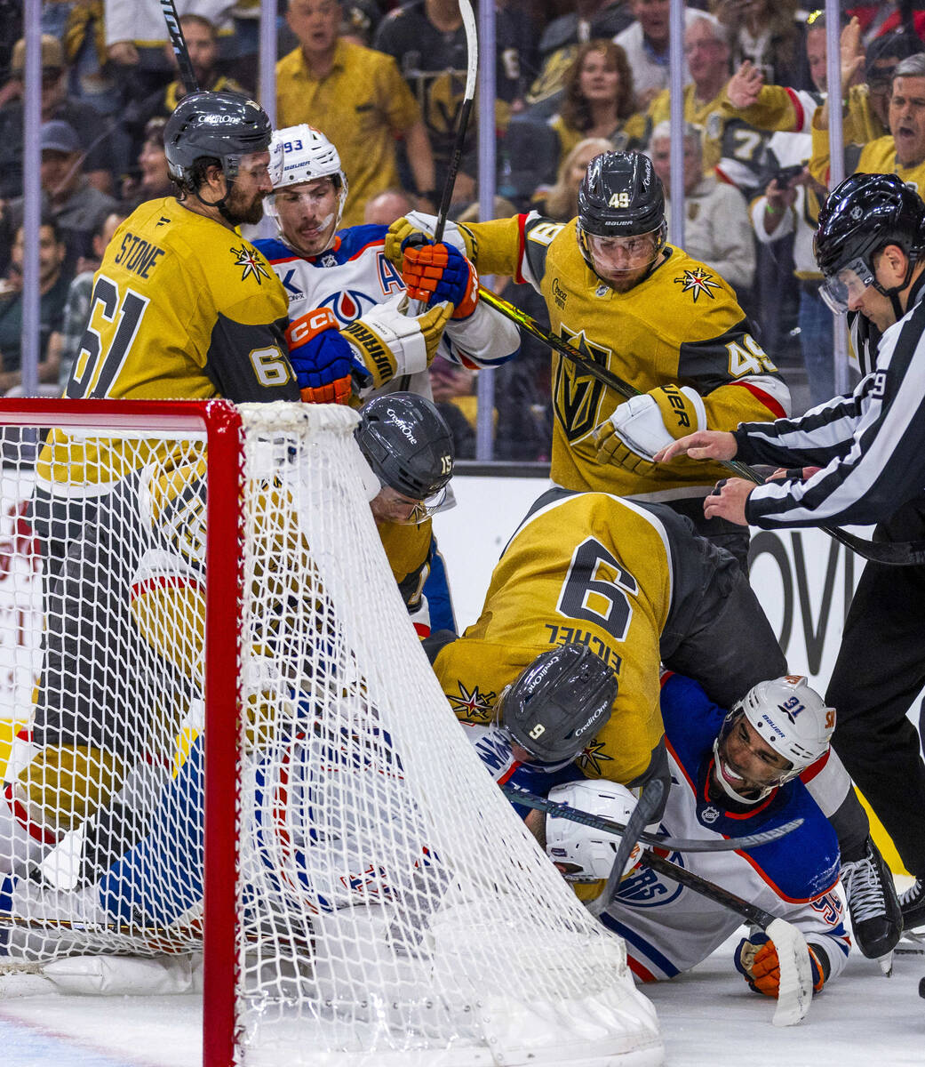 Edmonton Oilers left wing Evander Kane (91) starts a fight as Golden Knights center Jack Eichel ...