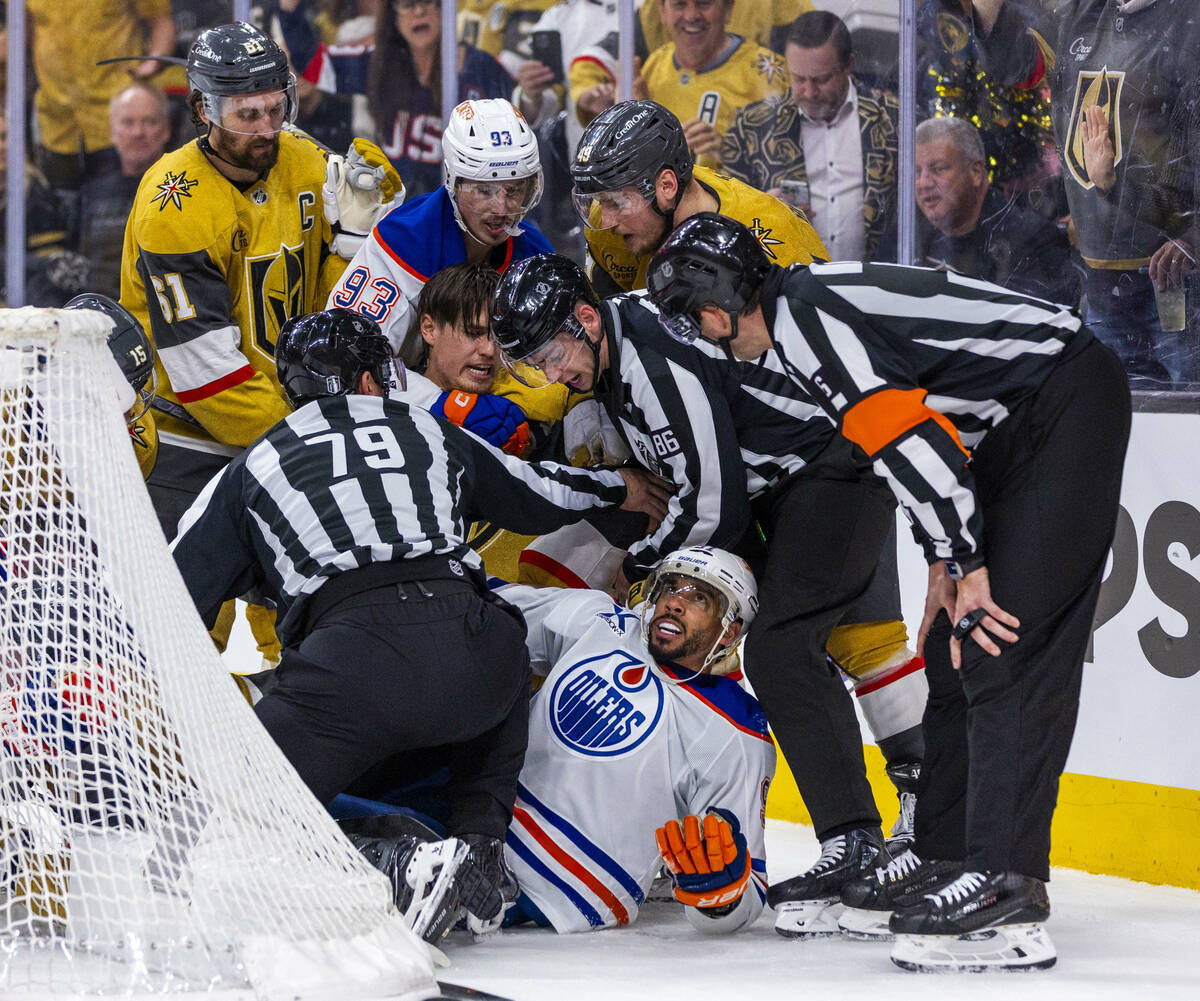Golden Knights defenseman Zach Whitecloud (2) has awards for Edmonton Oilers left wing Evander ...