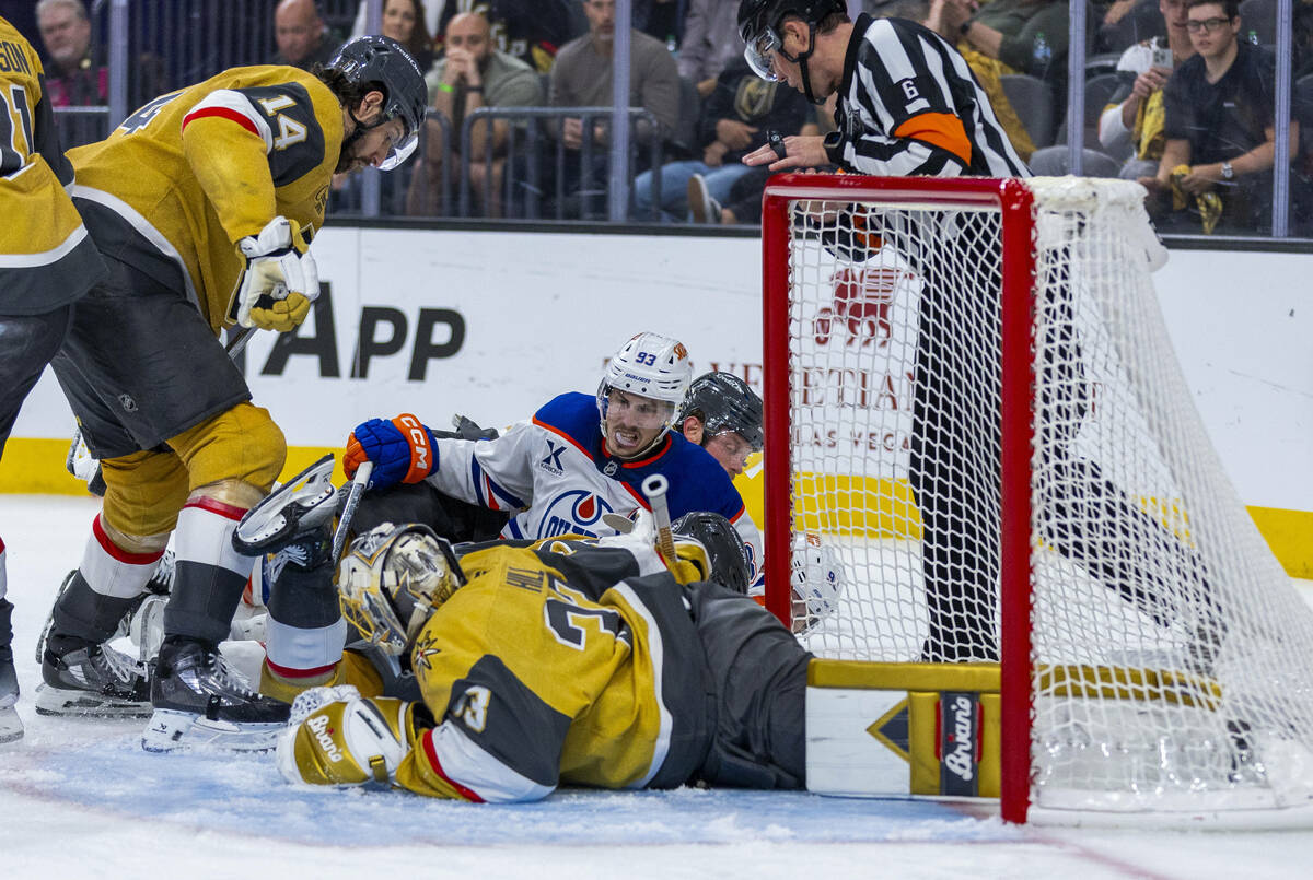 Golden Knights goaltender Adin Hill (33) stops a shot by Edmonton Oilers center Ryan Nugent-Hop ...