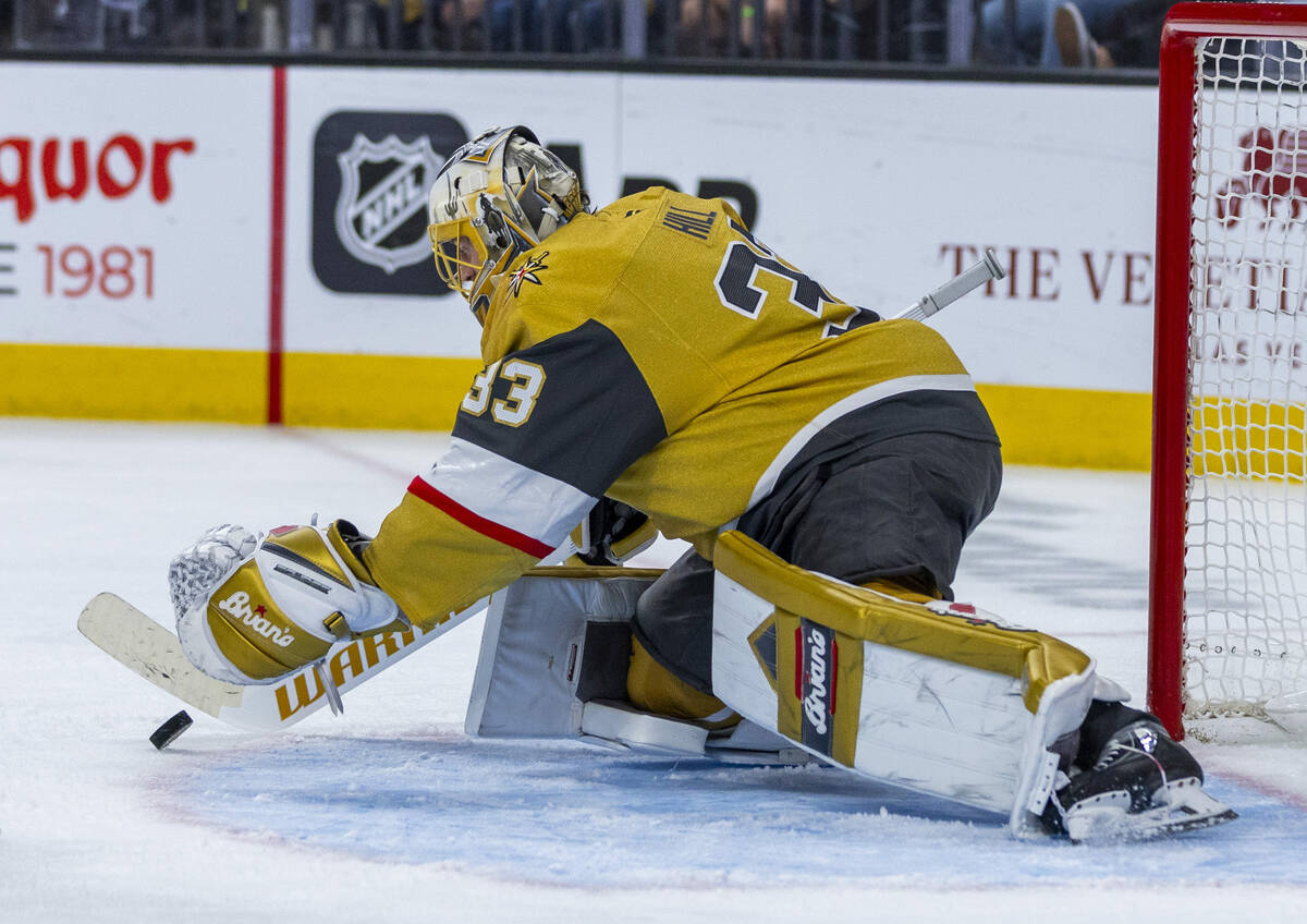 Golden Knights goaltender Adin Hill (33) stops a shot by the Edmonton Oilers during the overtim ...