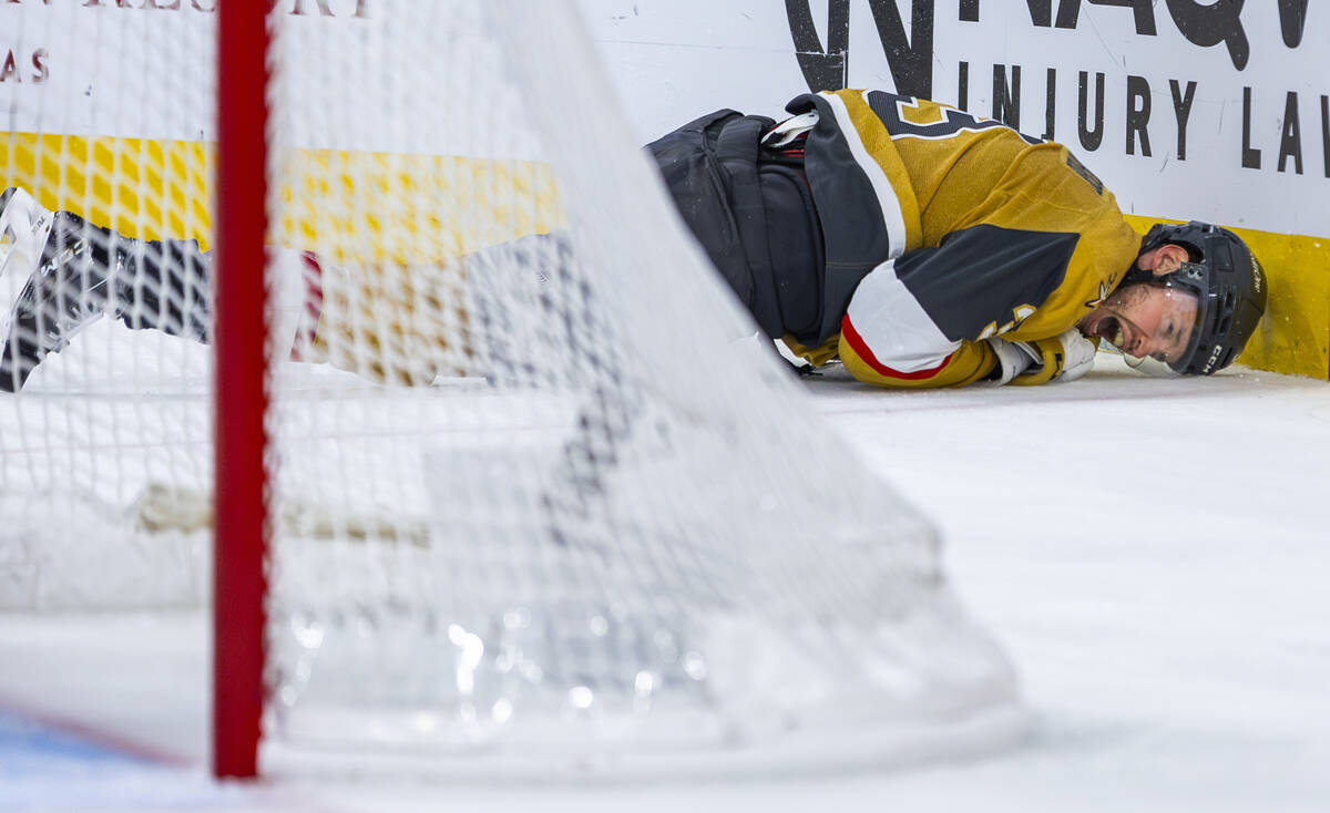 Golden Knights defenseman Brayden McNabb (3) crashes into the boards after being tripped by dur ...