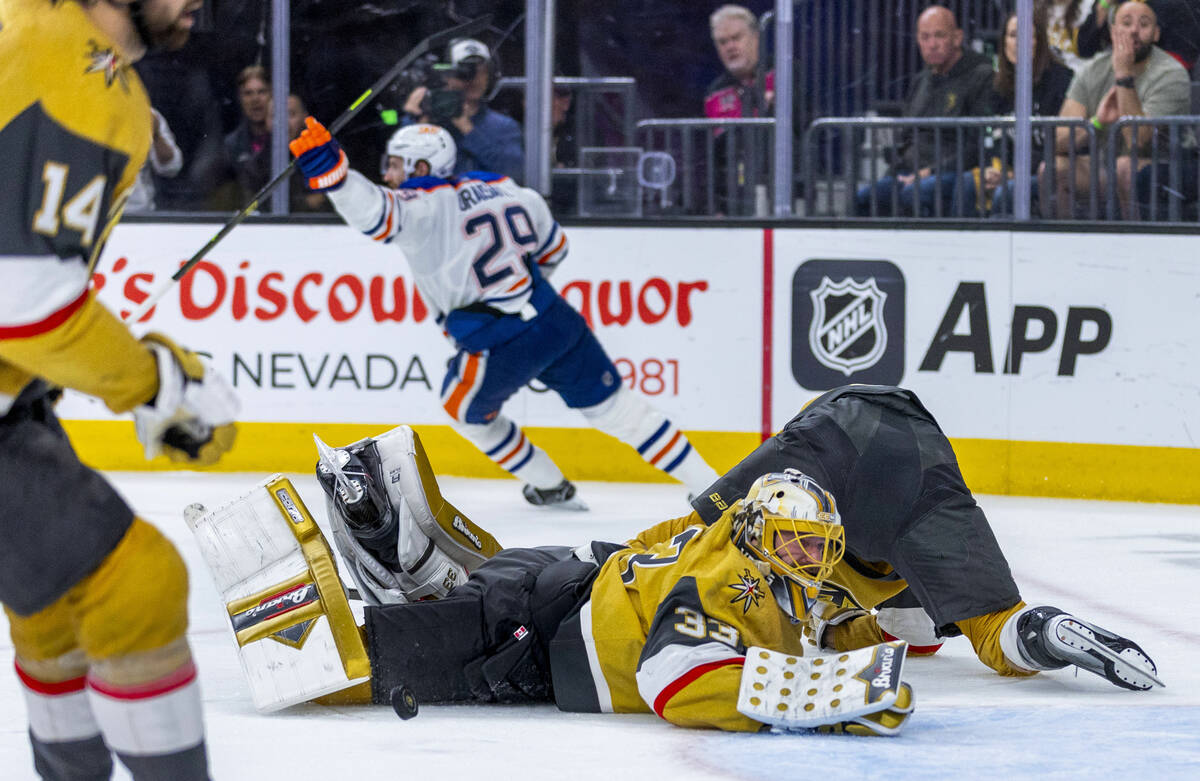 Golden Knights goaltender Adin Hill (33) dives but in unable to stop a shot by Edmonton Oilers ...