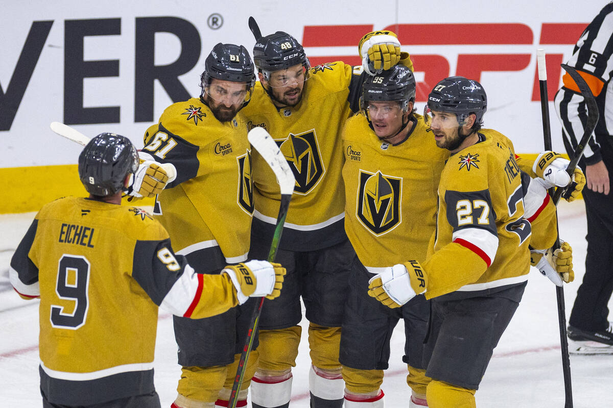 Golden Knights players celebrate a goal against Edmonton Oilers goaltender Calvin Pickard (30) ...