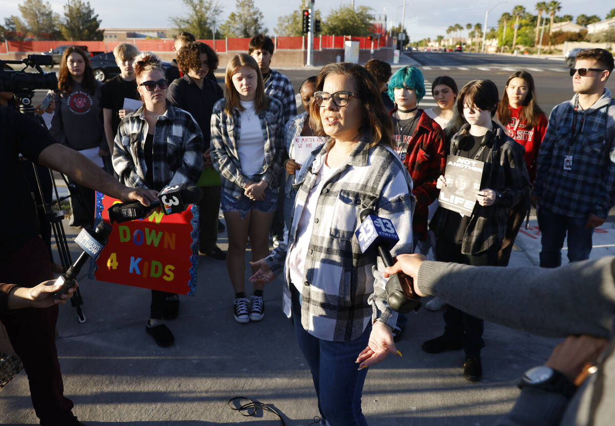 Krista Holloway, founder of "Walk Safely LV," speaks during a protest demanding justice for McK ...