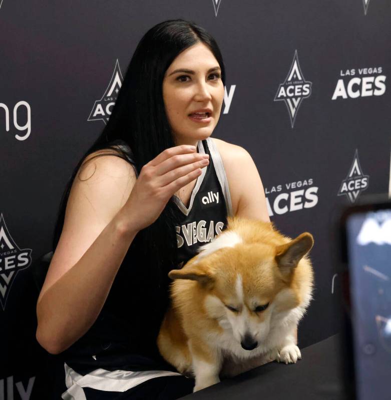 Las Vegas Aces center Megan Gustafson holds her dog Pancake as she speaks during team's media d ...