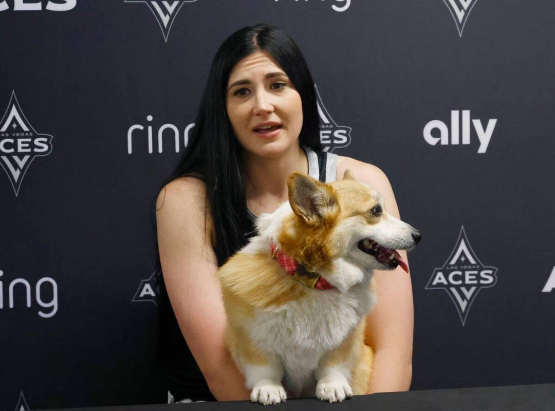 Las Vegas Aces center Megan Gustafson holds her dog Pancake as she speaks during team's media d ...