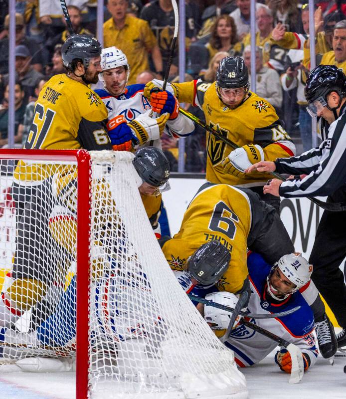 Edmonton Oilers left wing Evander Kane (91) starts a fight as Golden Knights center Jack Eichel ...