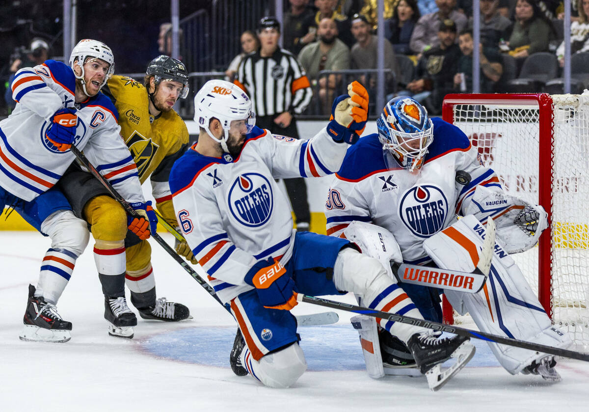 Edmonton Oilers goaltender Calvin Pickard (30) somehow traps a shot on goal under his arm past ...