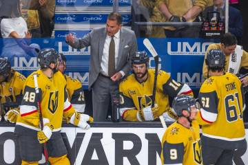Golden Knights head coach Bruce Cassidy speaks with his players on a time out against the Edmon ...