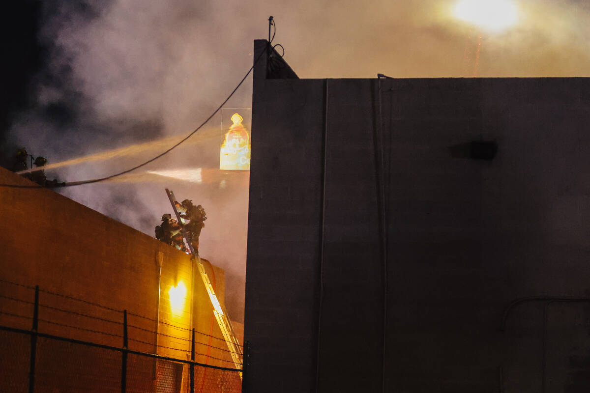 A fire burns near West Twain Avenue and South Highland Drive on Thursday, May 8, 2025, in Las V ...