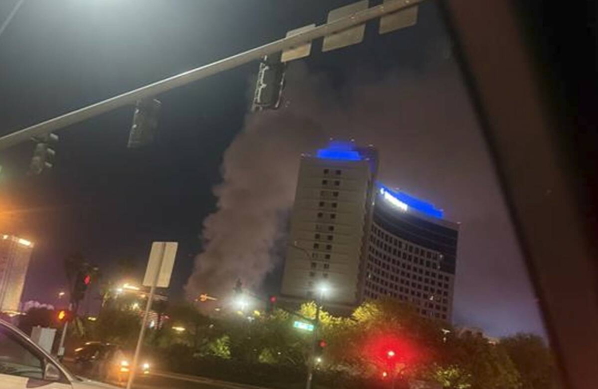 A fire burns near West Twain Avenue and South Highland Drive on Thursday, May 8, 2025, in Las V ...