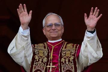 Newly elected Pope Leo XIV appears at the balcony of St. Peter's Basilica at the Vatican, Thurs ...