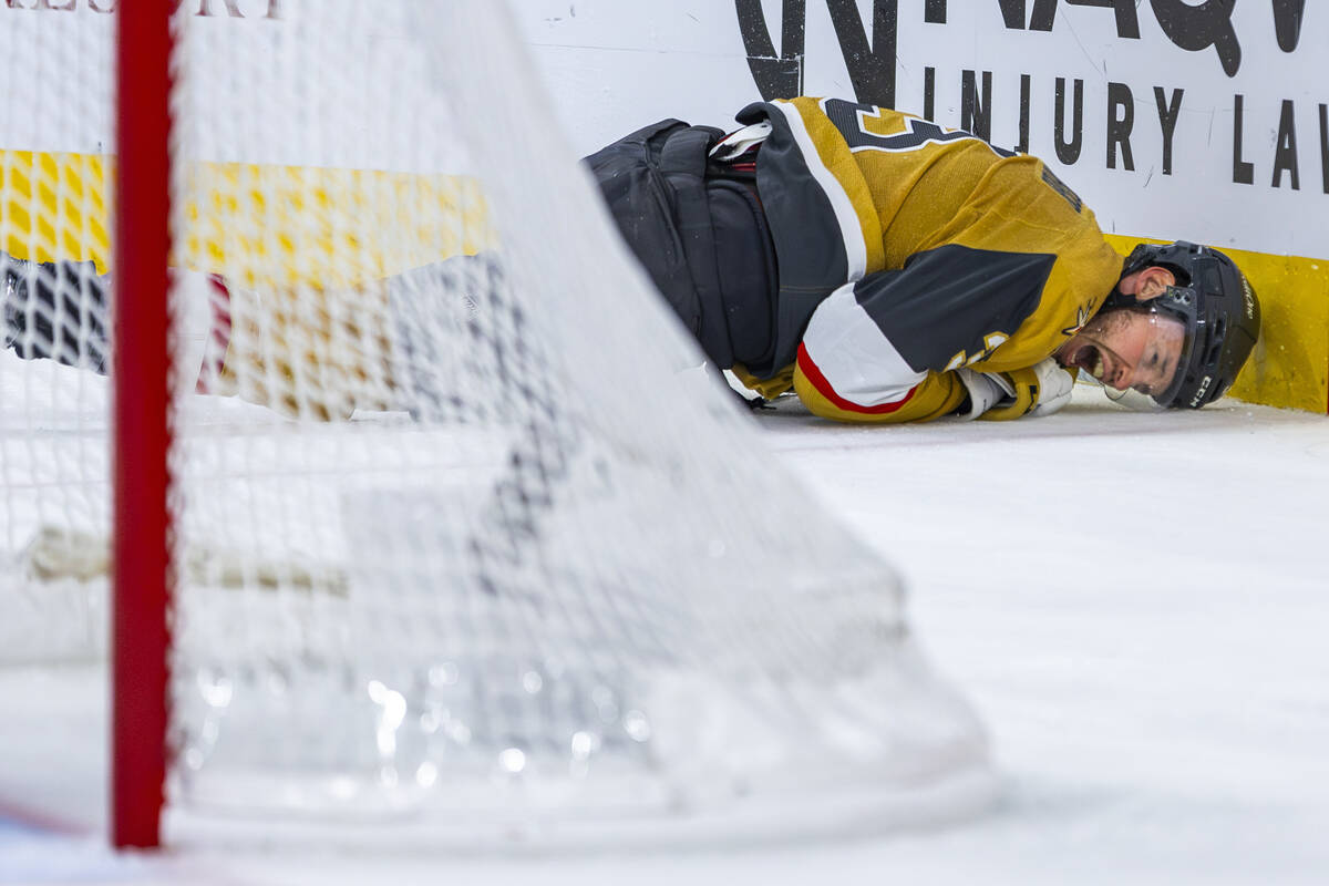 Golden Knights defenseman Brayden McNabb (3) crashes into the boards after being tripped by dur ...