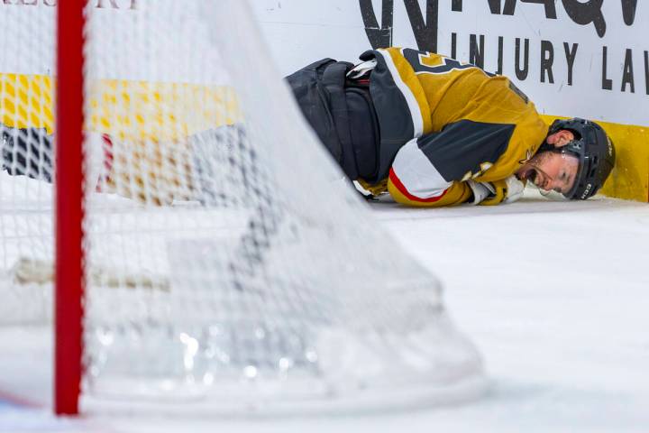 Golden Knights defenseman Brayden McNabb (3) crashes into the boards after being tripped by dur ...