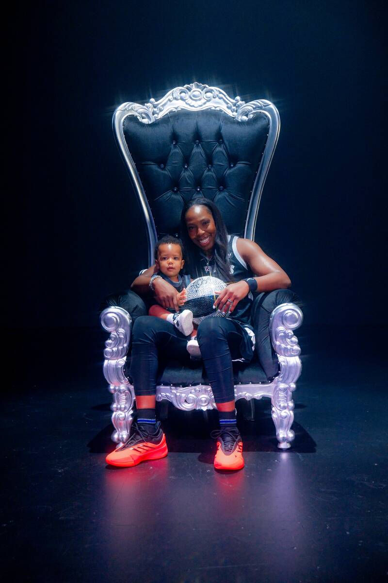 Aces point guard Chelsea Gray with her 1-year-old son, Lennox, at Aces media day Thursday, May ...