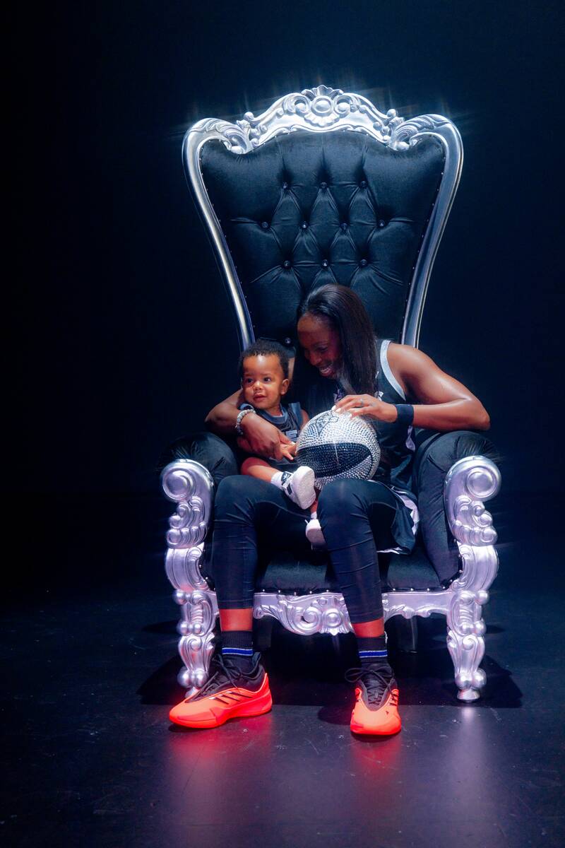 Aces point guard Chelsea Gray with her 1-year-old son, Lennox, at Aces media day Thursday, May ...