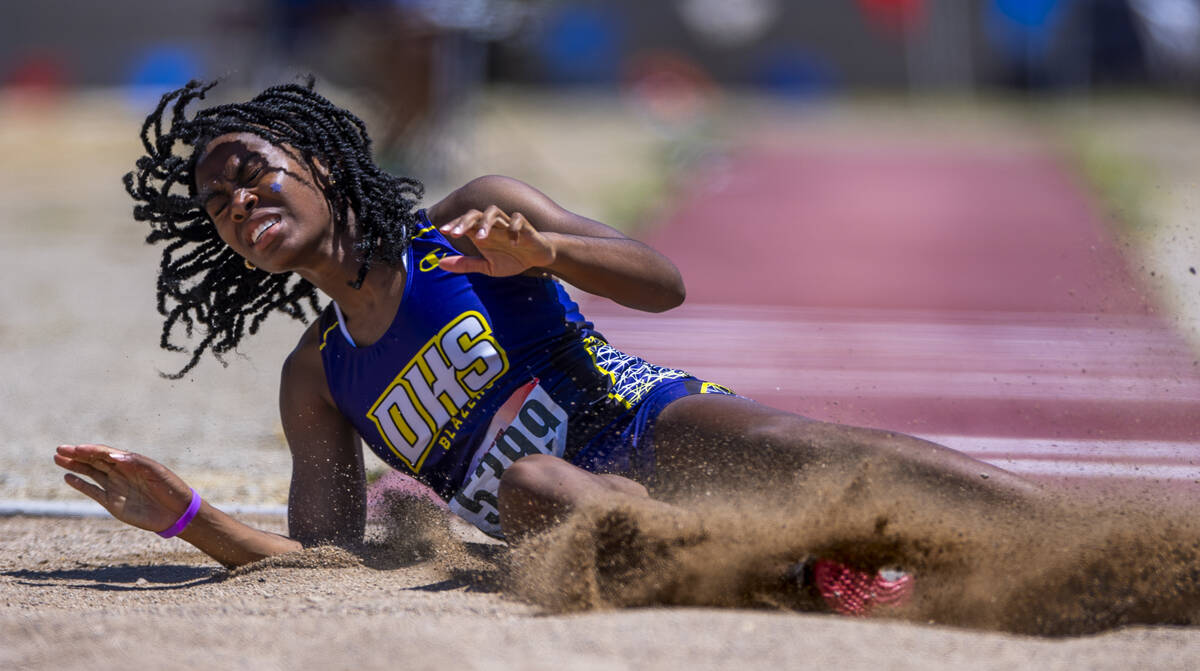 Durango's Amarie Riley (5399) leaps to a state qualifier in the 4A girls triple jump during the ...
