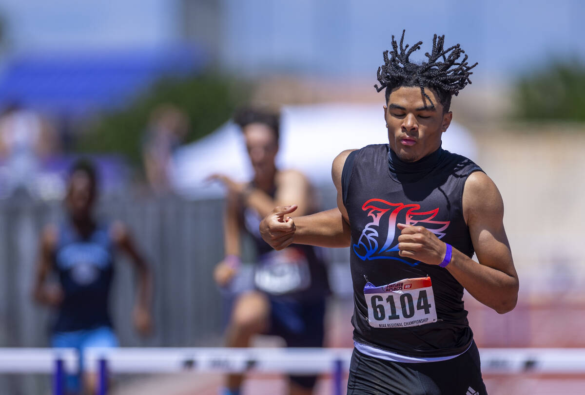 Liberty's Sean Craig (6104) finishes the boys 300 meter hurdles during the Class 5A Southern Re ...