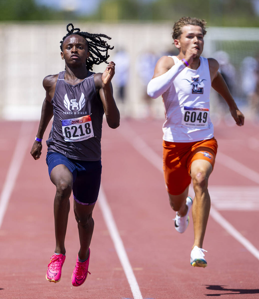 Shadow ridge's Kamari Mingo (6218) and Legacy's Sylus West-Gaither (6049) battle it out in the ...
