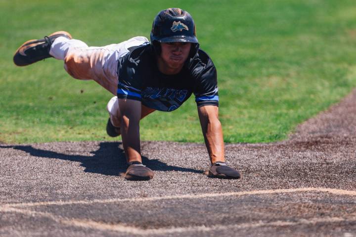 Basic’s Tate Southisene slides to home base during a 5A baseball Southern Region title g ...