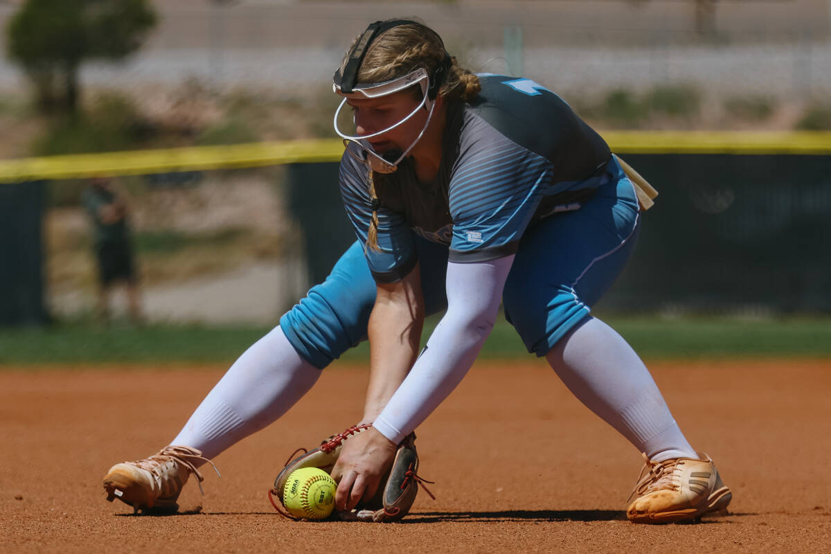 Centennial pitcher Sloane Merrell (18) scoops up a bunt during the NIAA 5A Southern Region fina ...