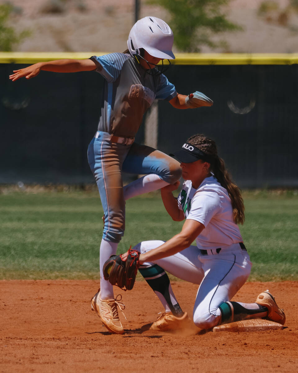Centennial’s Valeria Lopez (5) dodges a tag from Palo Verde infielder Taylor Johns (11) ...