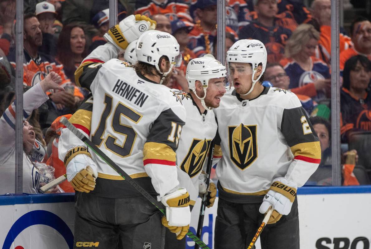 Vegas Golden Knights' Noah Hanifin (15), Reilly Smith (19) and Zach Whitecloud (2) celebrate af ...