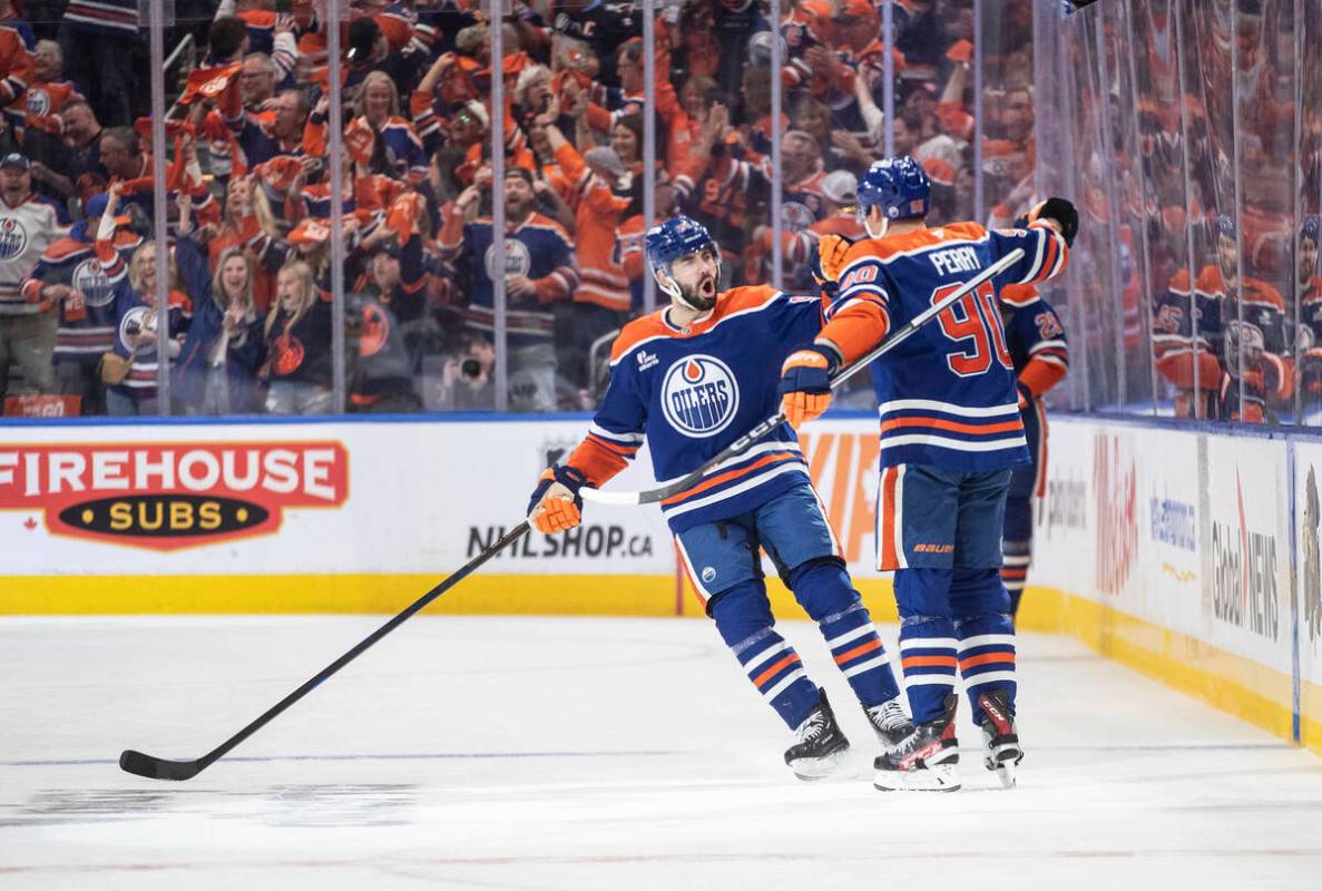Edmonton Oilers' Jake Walman (96), Corey Perry (90) and Connor Brown (28) celebrate after a goa ...