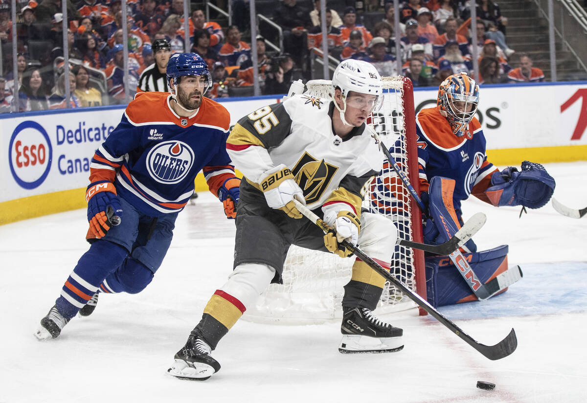 Vegas Golden Knights' Victor Olofsson (95) is chased by Edmonton Oilers' Evan Bouchard (2) as g ...