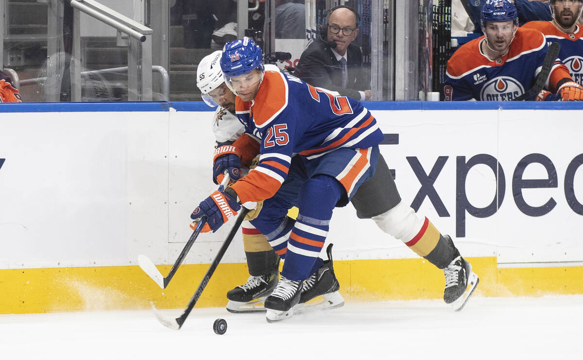 Vegas Golden Knights' Keegan Kolesar (55) and Edmonton Oilers' Darnell Nurse (25) battle for th ...