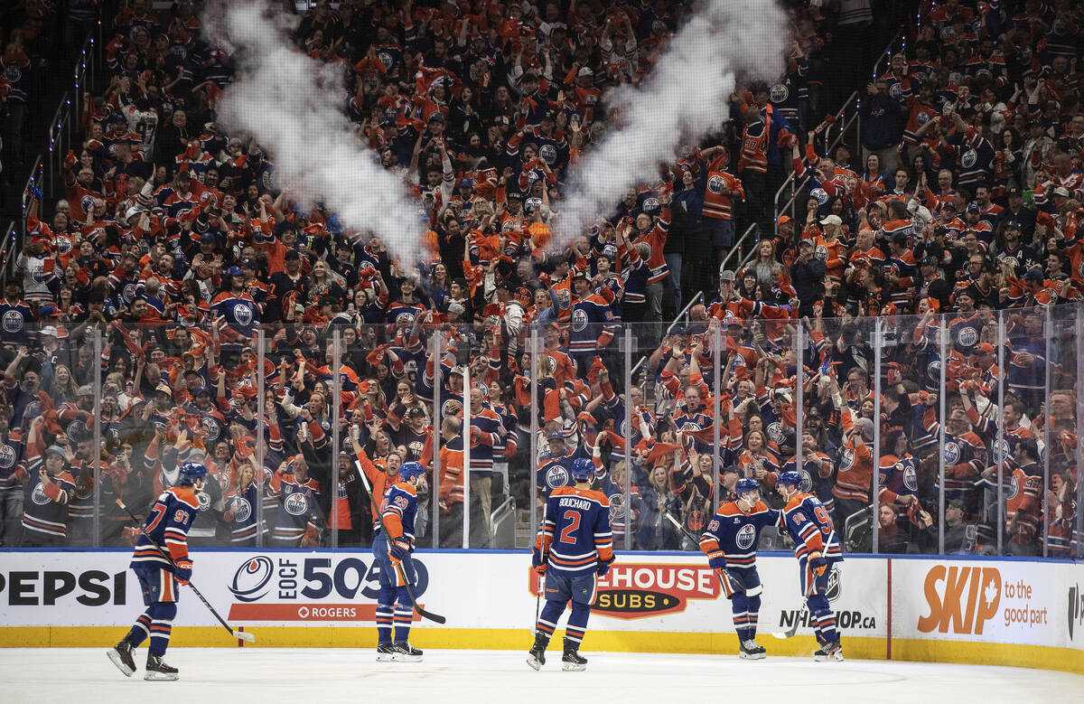 Edmonton Oilers players celebrate after a goal against the Vegas Golden Knights during the firs ...