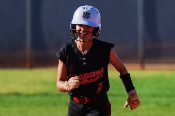 Doral Academy pitcher EmmaLynn Hussey runs to third base during a softball game between Basic a ...