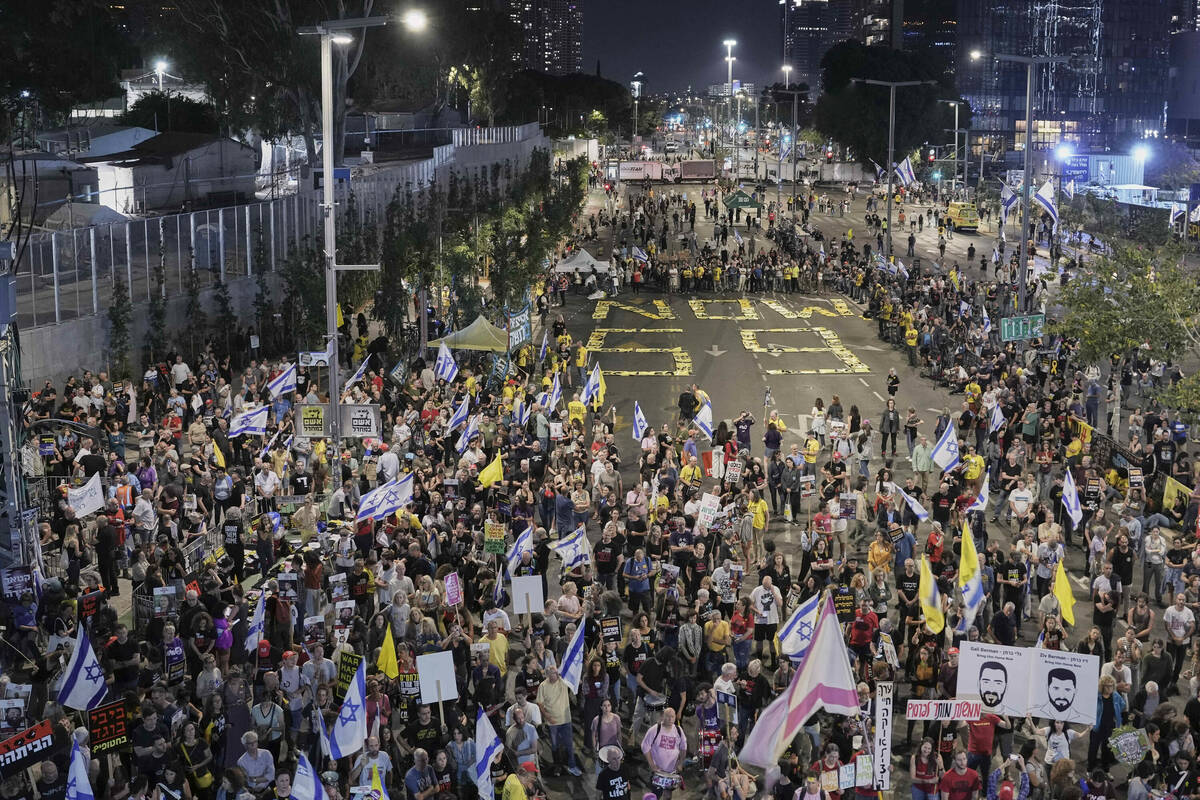 People take part in a protest in Tel Aviv, Israel, Saturday, May 10, 2025, demanding the immedi ...