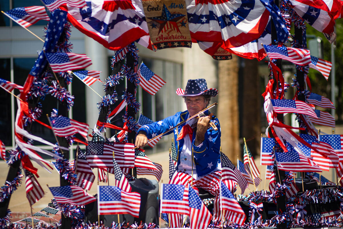 A fiddler performs on the Americana Man float during the annual Helldorado Days Parade on Satur ...