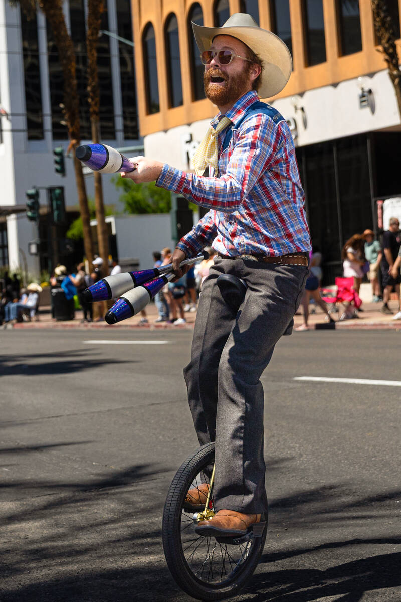 Kyle Petersen juggles on a unicycle during the annual Helldorado Days Parade on Saturday, May 1 ...