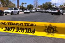 Police tape blocks the road while Metro investigates an officer involved shooting Tuesday, June ...