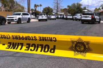 Police tape blocks the road while Metro investigates an officer involved shooting Tuesday, June ...