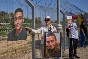 Varda Ben Baruch holds a picture of her grandson Edan Alexander, who is held hostage in Gaza, g ...