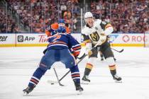 Vegas Golden Knights' Jack Eichel (9) tries to get past Edmonton Oilers' Evan Bouchard (2) duri ...