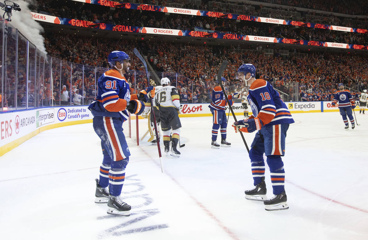 Edmonton Oilers' Evander Kane (91) and Zach Hyman (18) celebrate after a goal against the Vegas ...
