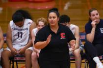 Coronado head coach Jazlynn Mau talks to her team during a high school volleyball game against ...