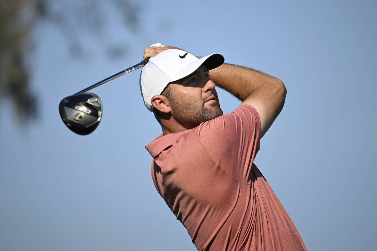 Scottie Scheffler looks on after hitting his tee shot on the 15th hole during the second round ...