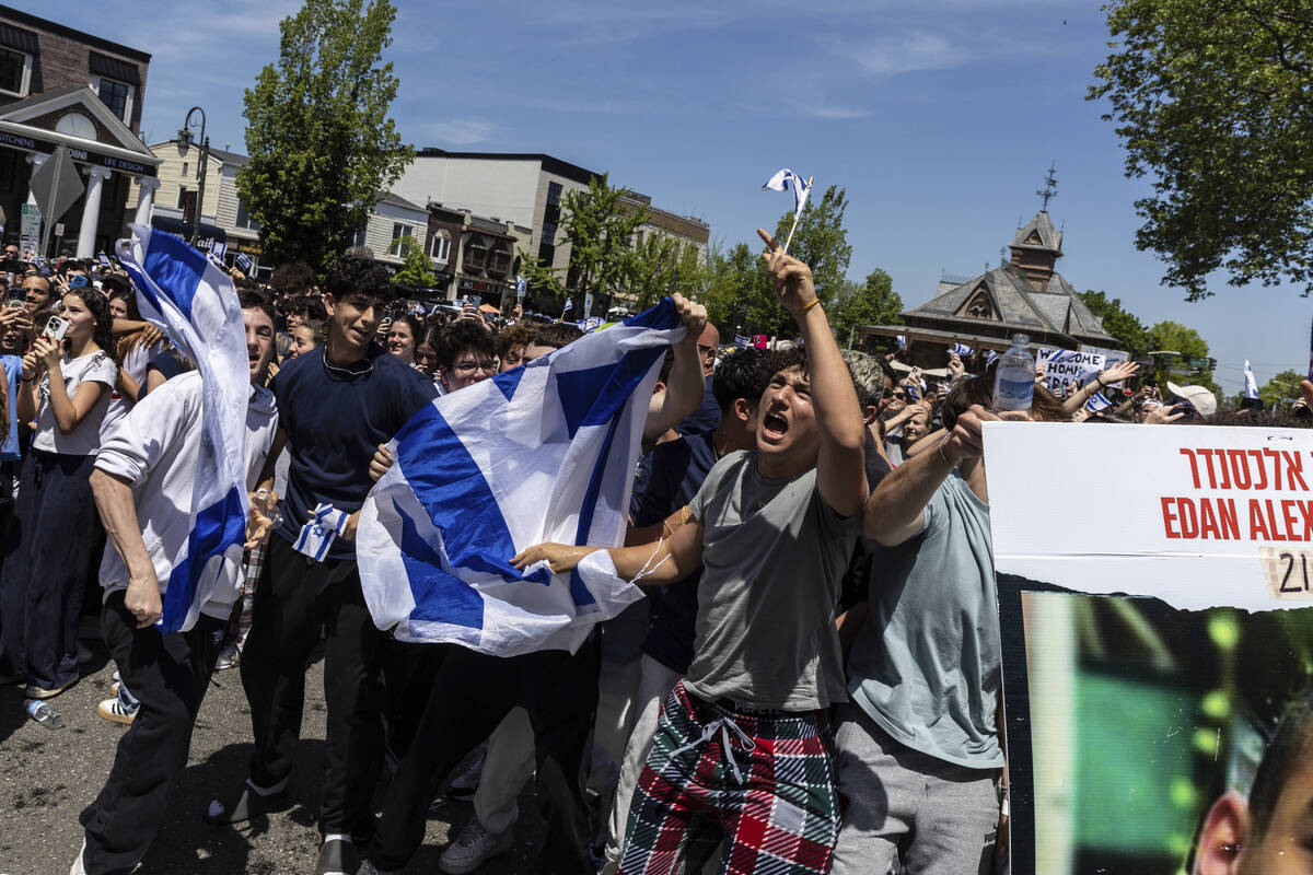 People gathered in Huyler Park celebrate the release of American hostage Edan Alexander from Ha ...