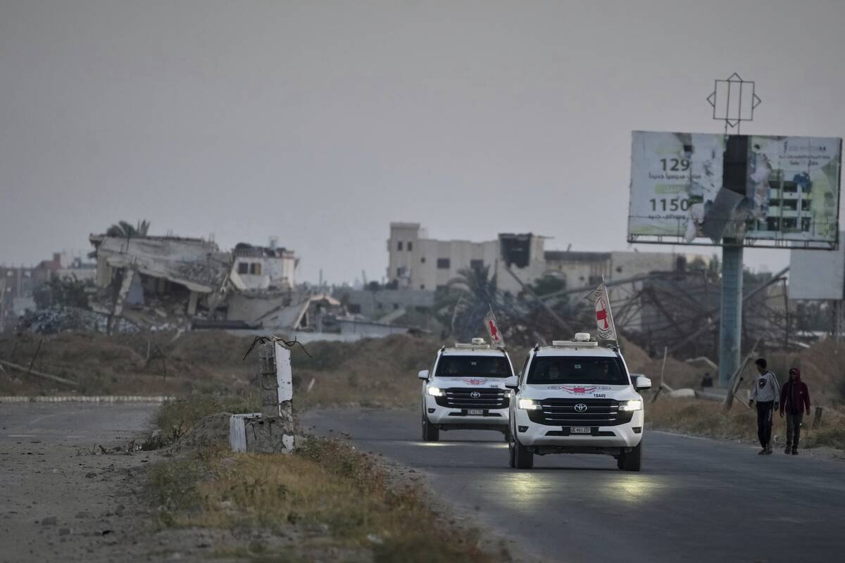 Red Cross vehicles carrying American-Israeli hostage and soldier Edan Alexander leave the Gaza ...
